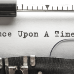 A typewriter with the words "Once Upon a Time" typed on the page.